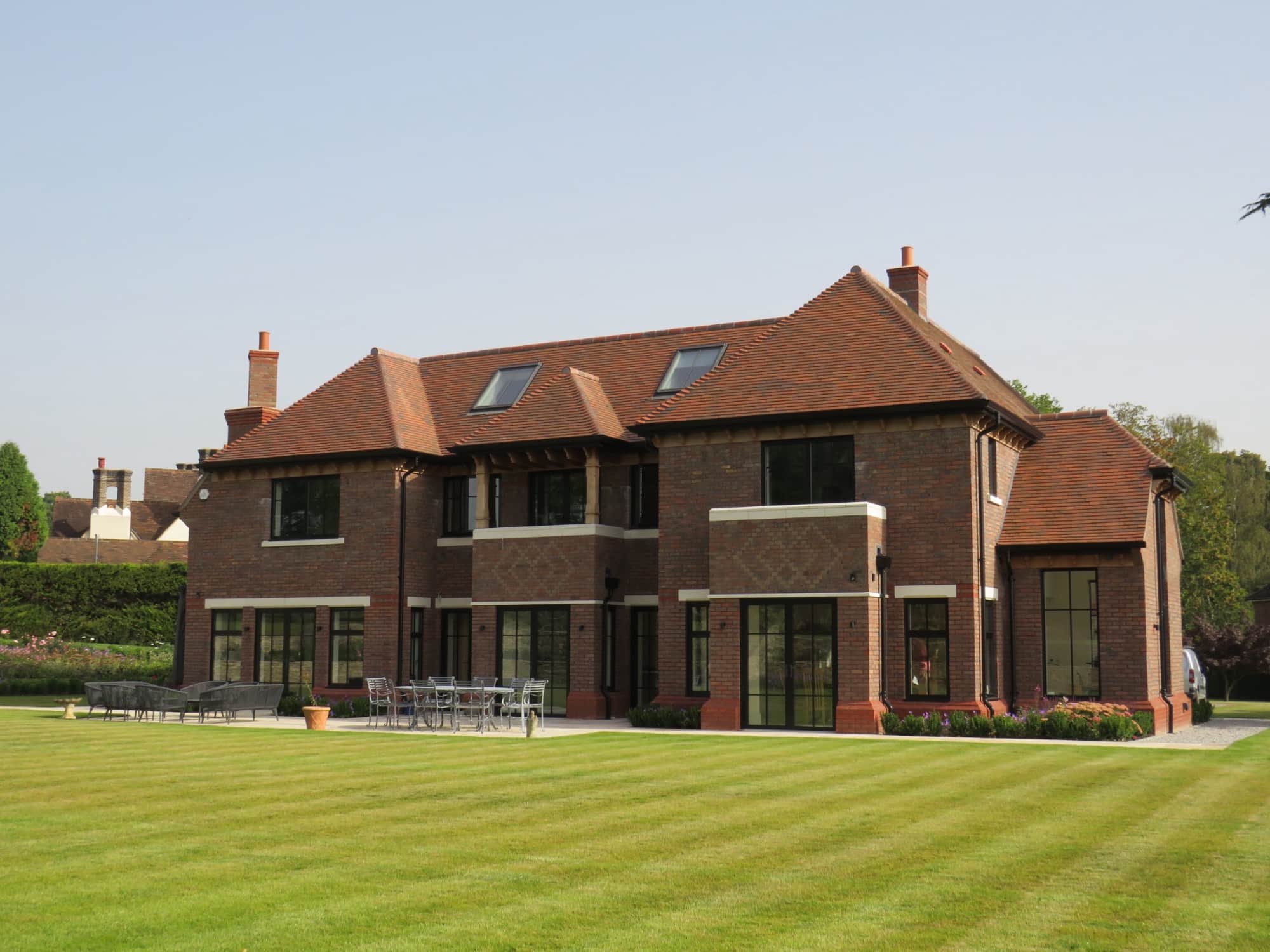 Large detached house with matching timber windows and doors installed by Mason Woodbury